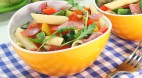 Penne pasta salad, tomatoes, chorizo and fresh scallions