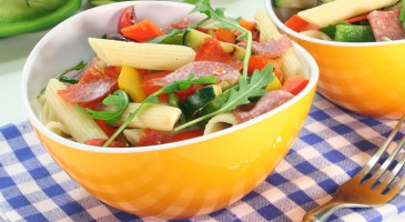 Penne pasta salad, tomatoes, chorizo and fresh scallions