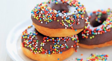 American recipe: Chocolate glazed doughnuts with assorted sprinkles