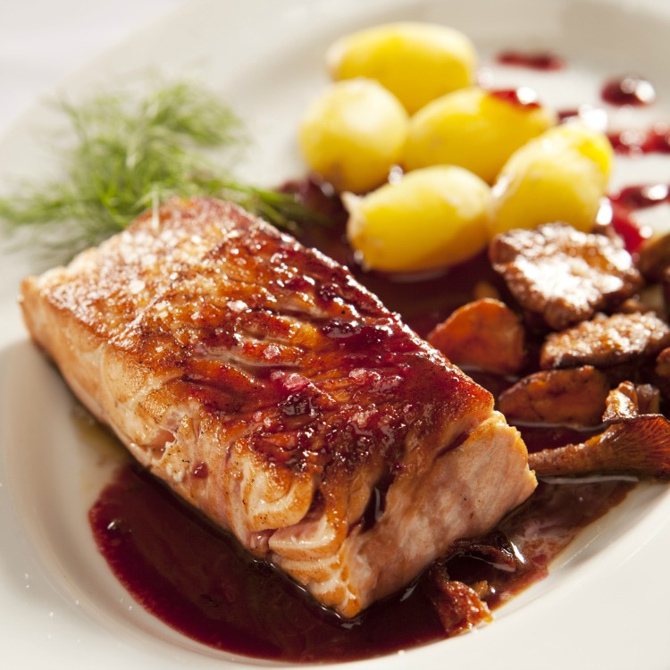 Gourmet fish recipe Salmon fillet with chanterelle mushrooms