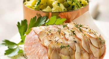 Gourmet fish dish: salmon fillet and potato scales